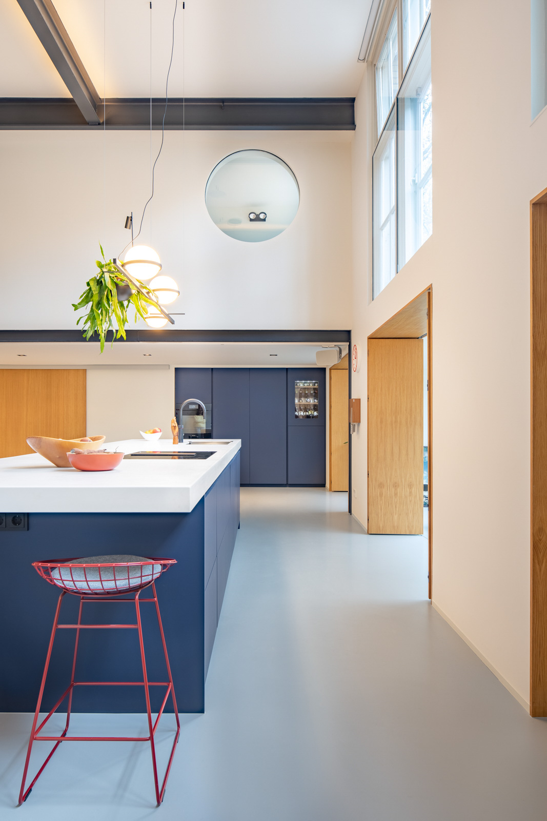 view of the funky kitchen of an urban loft in Amsterdam By Standard Studio